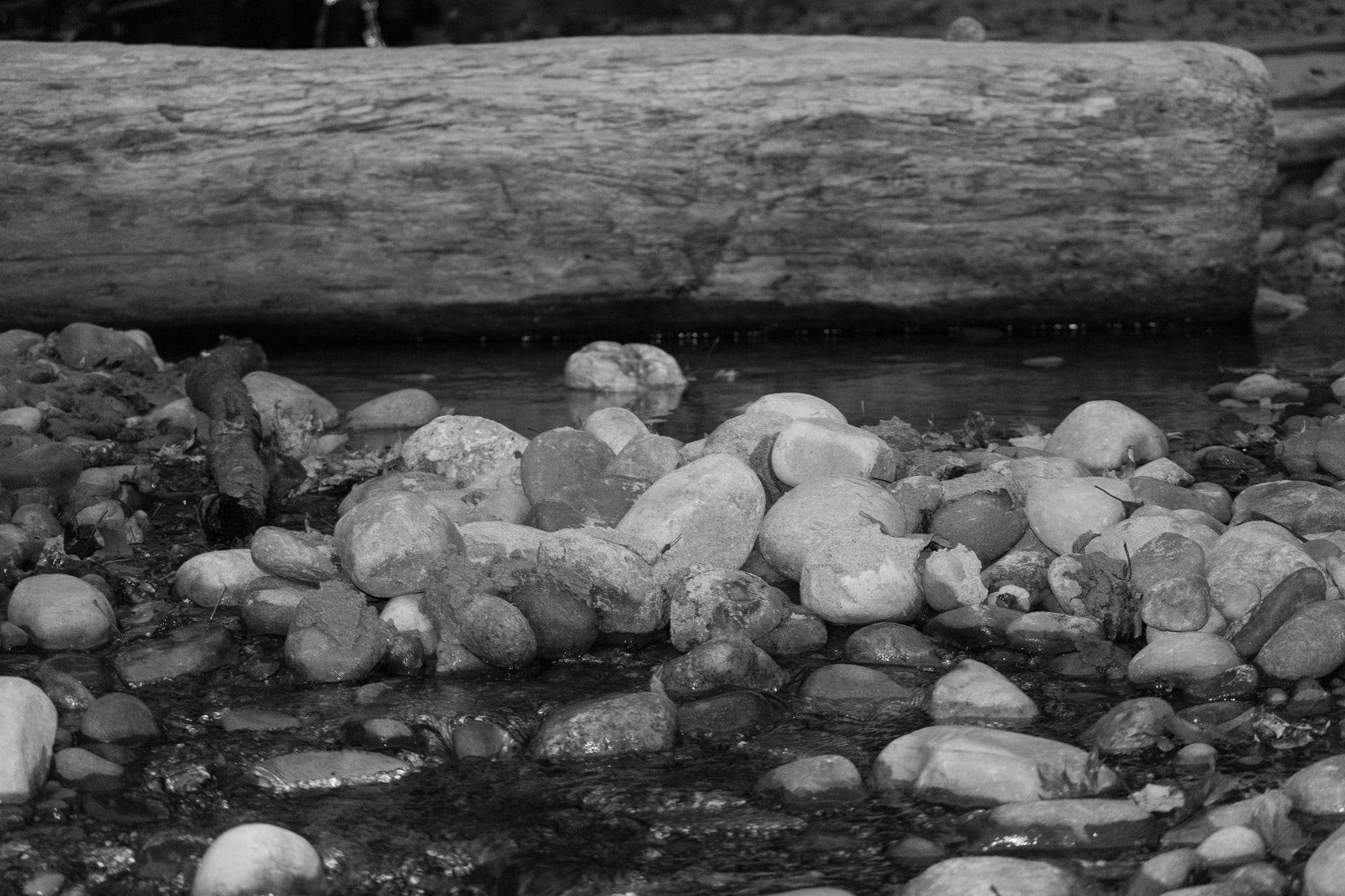 A small rocky creek feeds into Lake Michigan.
